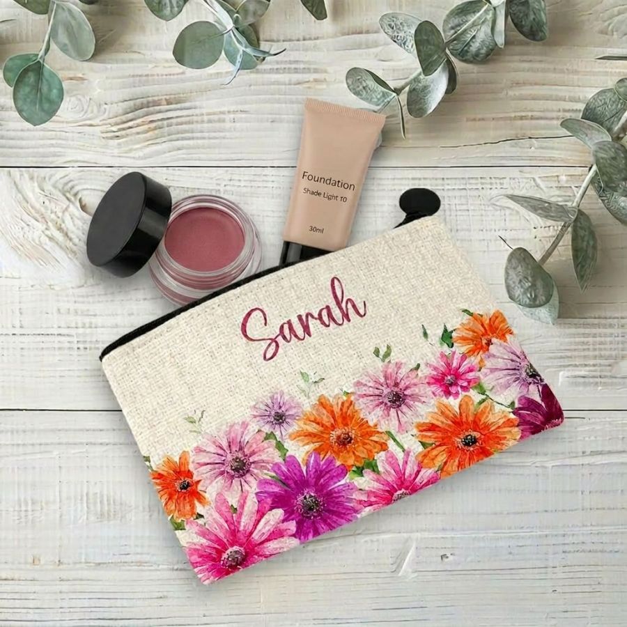 Coin purse printed with gerberas with makeup inside.
