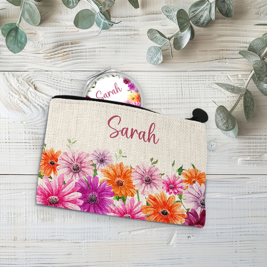 Linen coin purse featuring daisies with a compact mirror inside.
