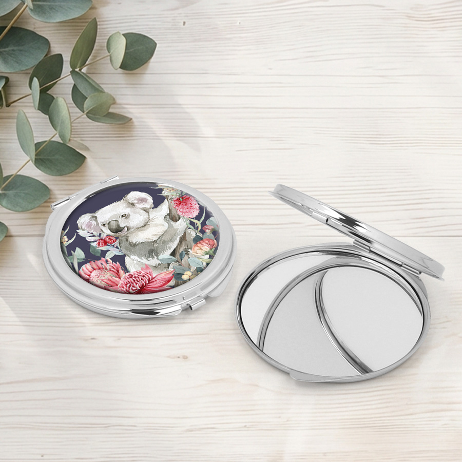Compact mirror featuring a koala.