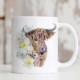 Highland cow mug with daffodils