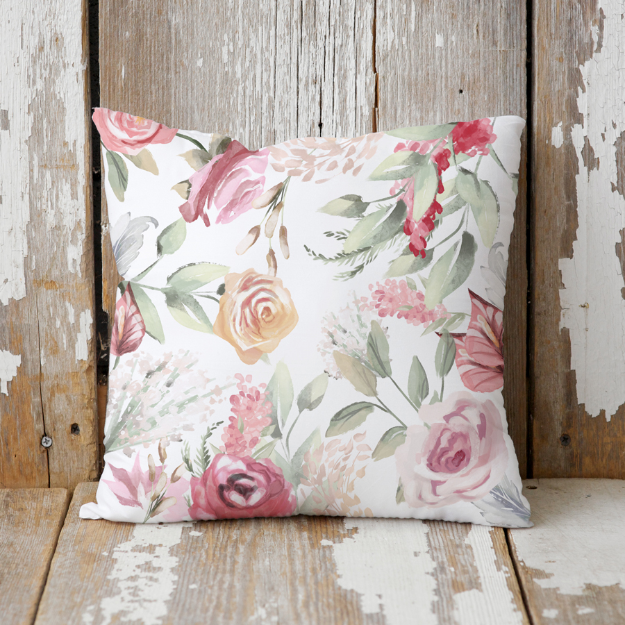 Pink roses on a cushion.