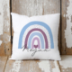 Personalised cushion with a blue rainbow.