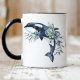 Ceramic mug with black rim and handle featuring an orca.
