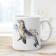 Ceramic mug featuring a seal.